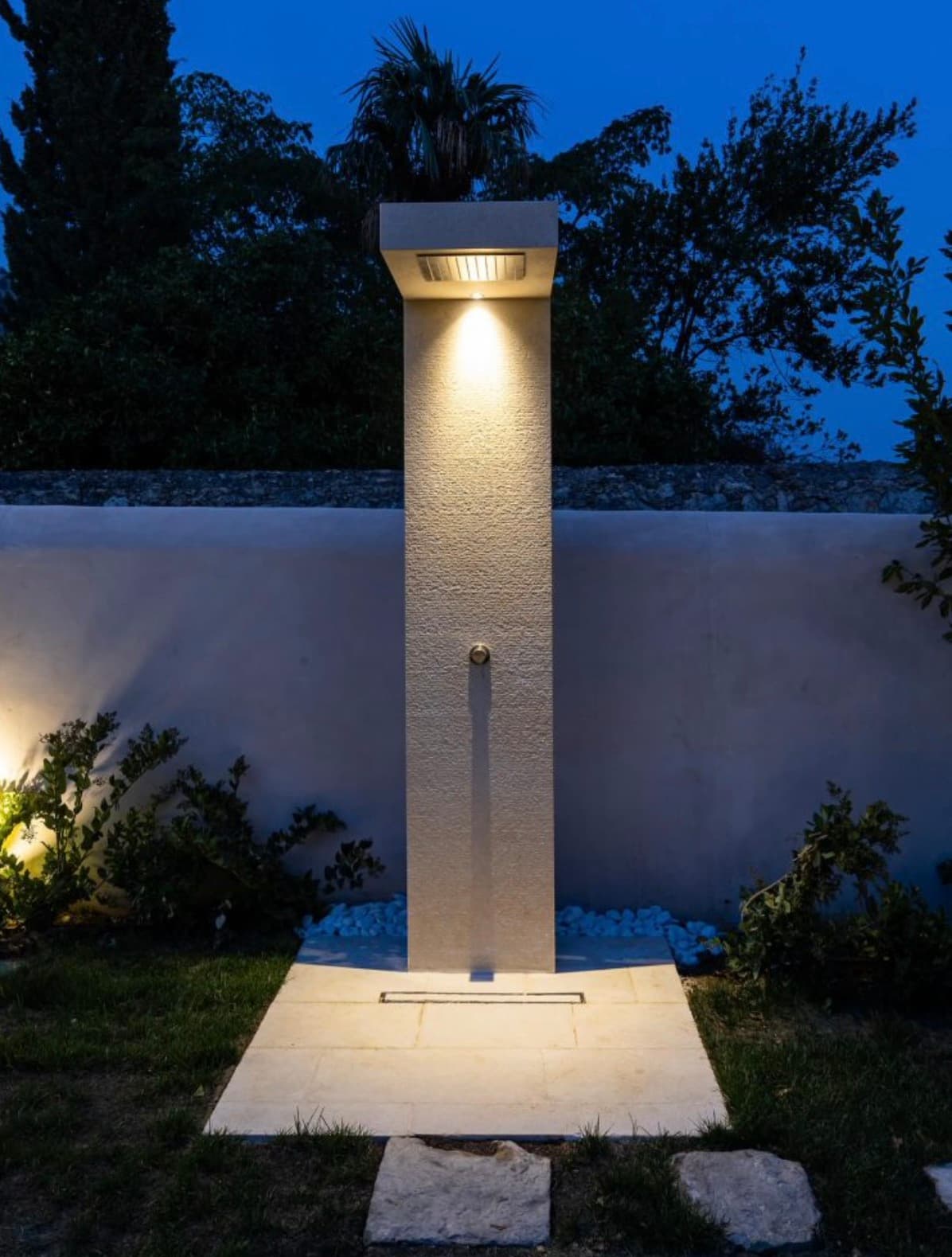 Detail of a hand-carved limestone outdoor shower